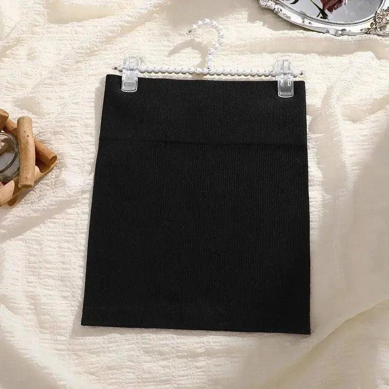 Black ribbed mini skirt on pearl hanger, women's fashion, soft fabric, stylish outfit essential