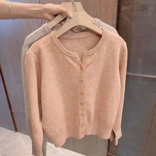 Soft peach button-front cardigan sweater, women's fashion, cozy knitwear for casual style