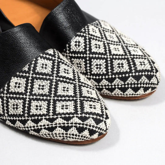 Black and white patterned women's loafers with textured geometric design, stylish fashion footwear