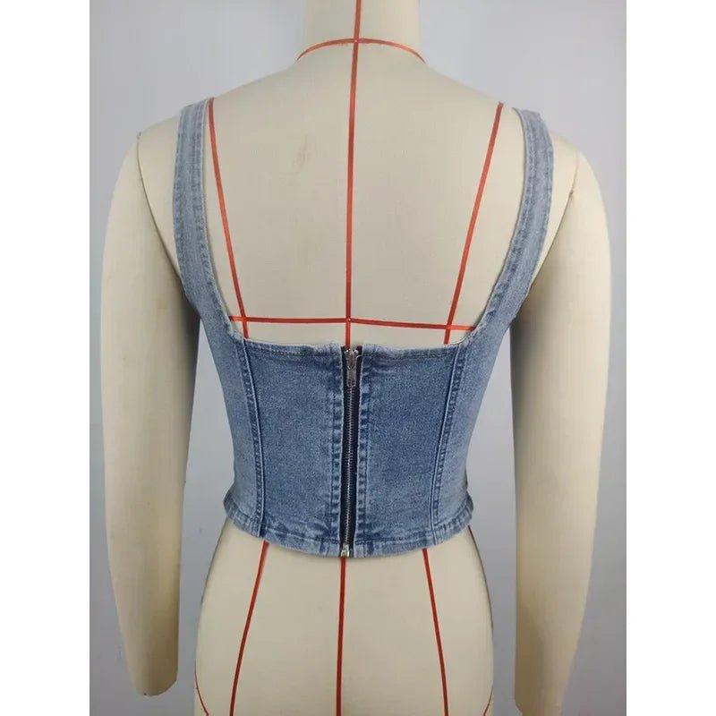 Denim corset top with back zipper and strappy design on mannequin, women's fashion