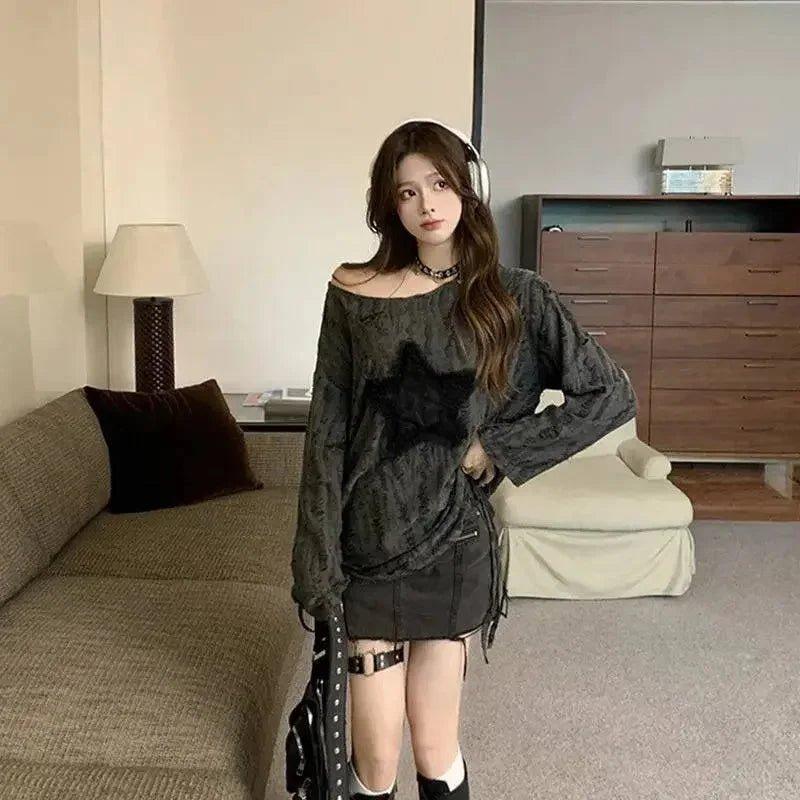 Woman in edgy black star print top, mini skirt, and thigh straps, stylish fashion outfit