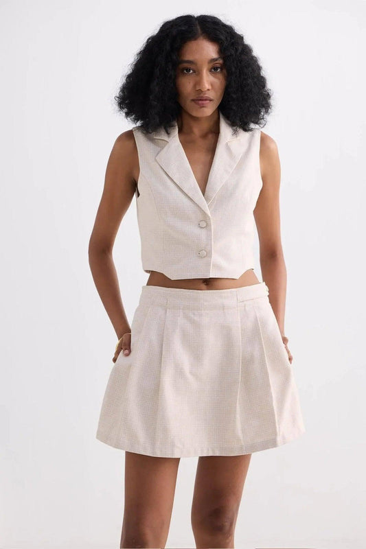 Cream sleeveless blazer vest and pleated mini skirt set for women's fashion