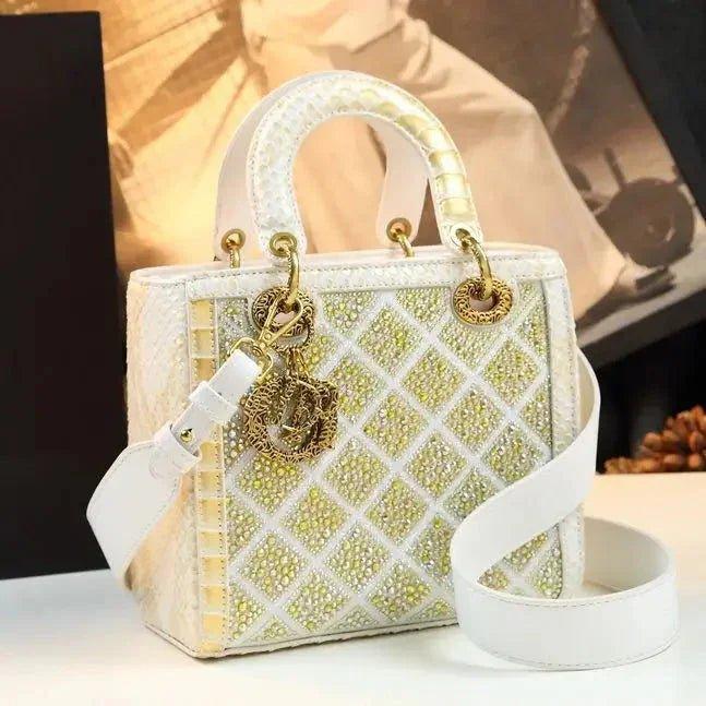 Elegant white and gold crystal-embellished handbag with quilted design and gold hardware, perfect for women's fashion.
