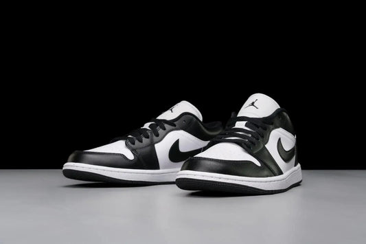 Black and white Air Jordan 1 low sneakers with Nike swoosh, stylish women's fashion footwear