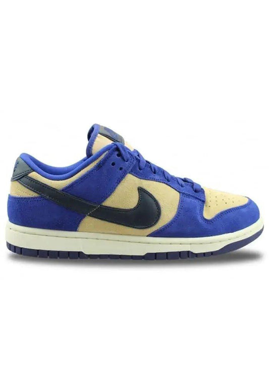 Blue and beige Nike Dunk Low sneaker with black swoosh, stylish women's fashion footwear