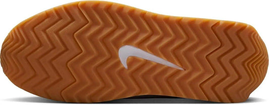 Nike shoe sole with gum rubber zigzag tread and white swoosh logo for women's fashion footwear