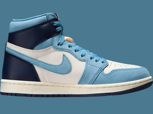 Women's high-top sneaker in light blue, white, and navy with Nike swoosh, stylish fashion footwear