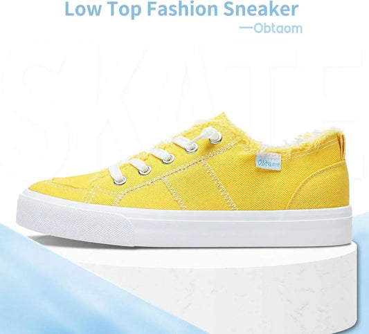 Yellow low top fashion sneaker with white laces and platform sole for women's casual wear