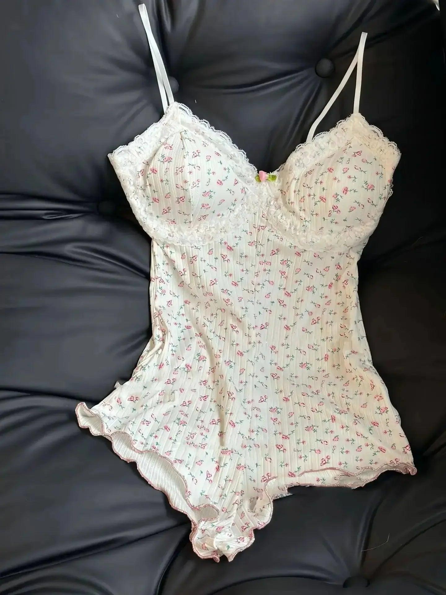 Floral lace-trimmed camisole with ruffled hem, women's fashion sleepwear on black leather