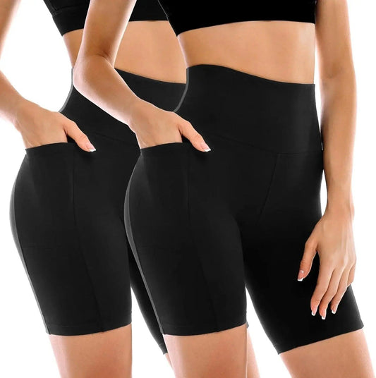 Black high-waisted biker shorts with pockets for women, ideal for fitness and casual wear