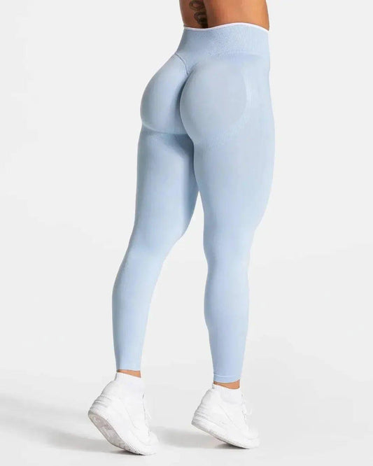 Light blue high-waisted leggings with sculpting design, paired with white sneakers for women's fashion