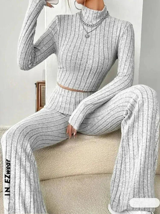 Gray ribbed women's lounge set with high neck top and wide-leg pants, cozy fashion wear