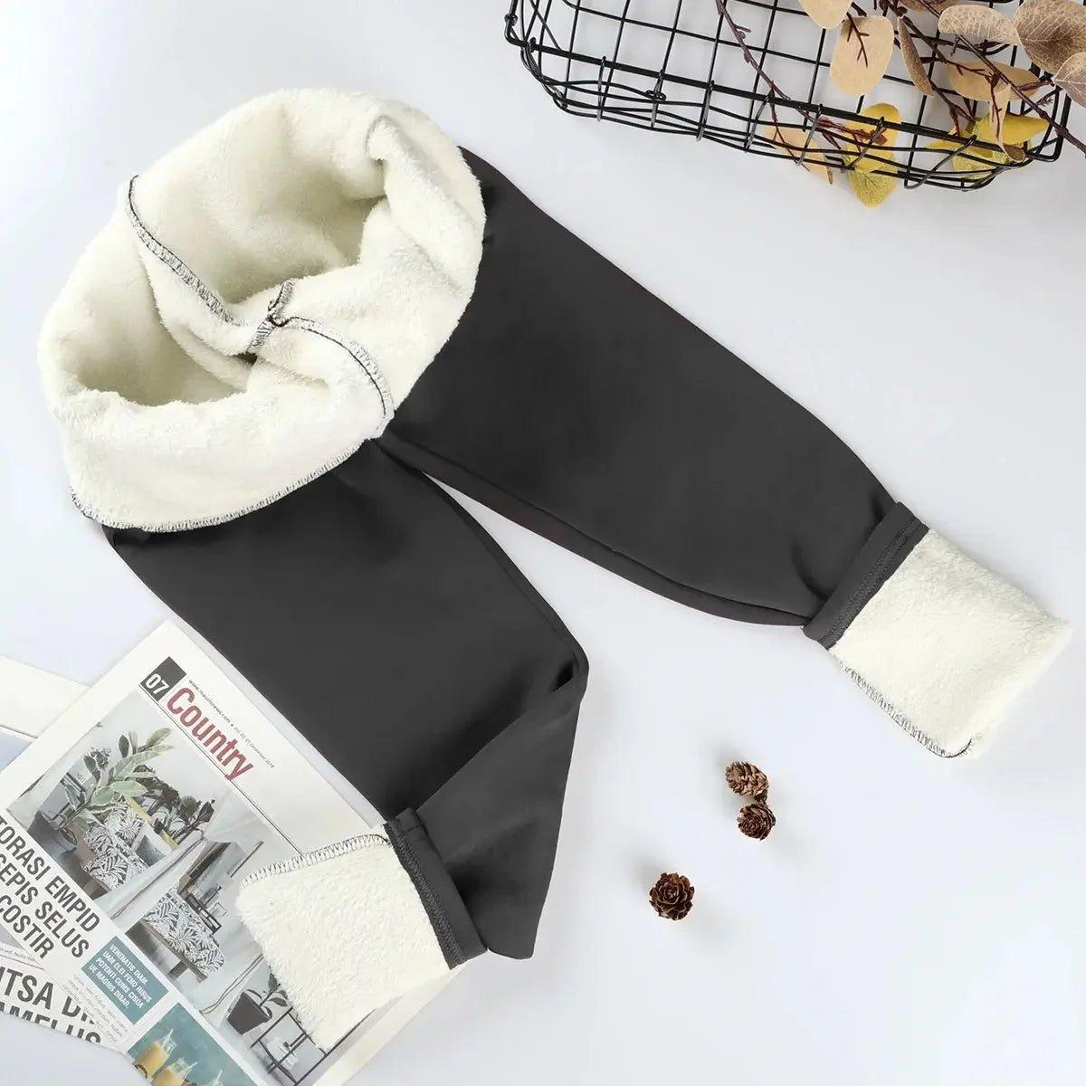 Black women's fleece-lined joggers with cozy white interior, perfect for winter fashion
