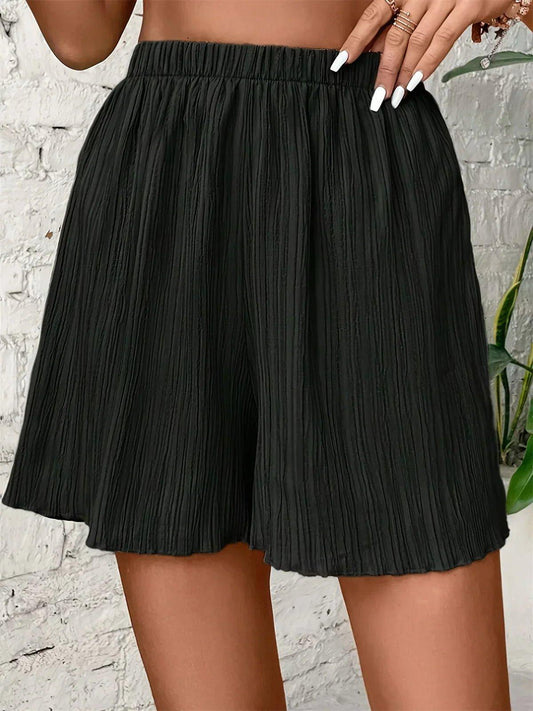 Black pleated high-waist women's shorts with elastic waistband, fashion summer wear