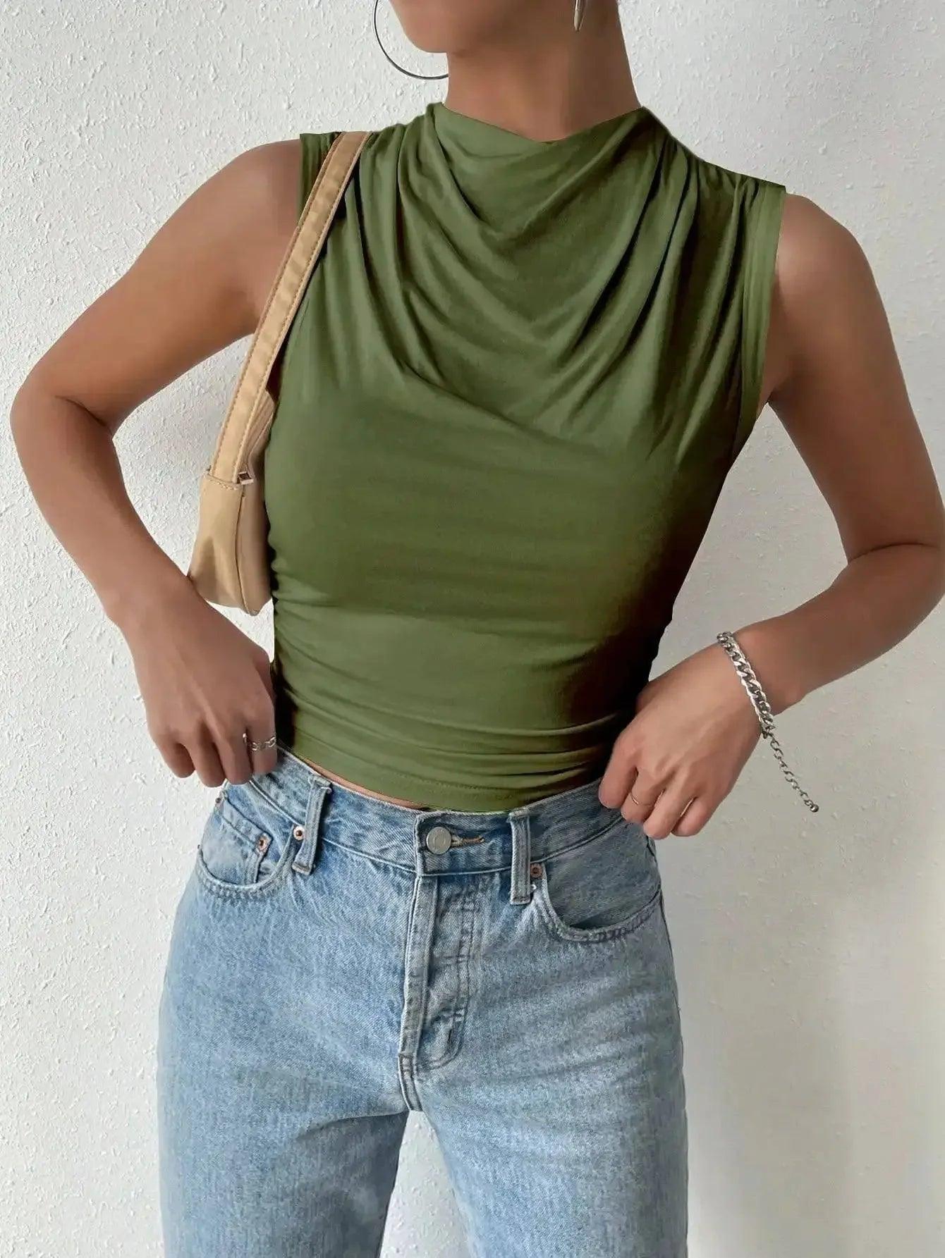 Olive green sleeveless cowl neck top with high-waisted jeans, women's fashion