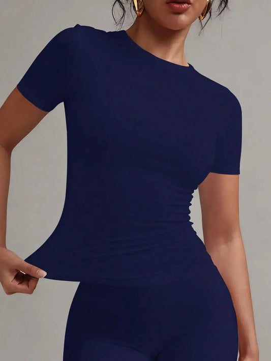 Navy blue ruched short sleeve top for women, stylish fashion fit with gold earrings