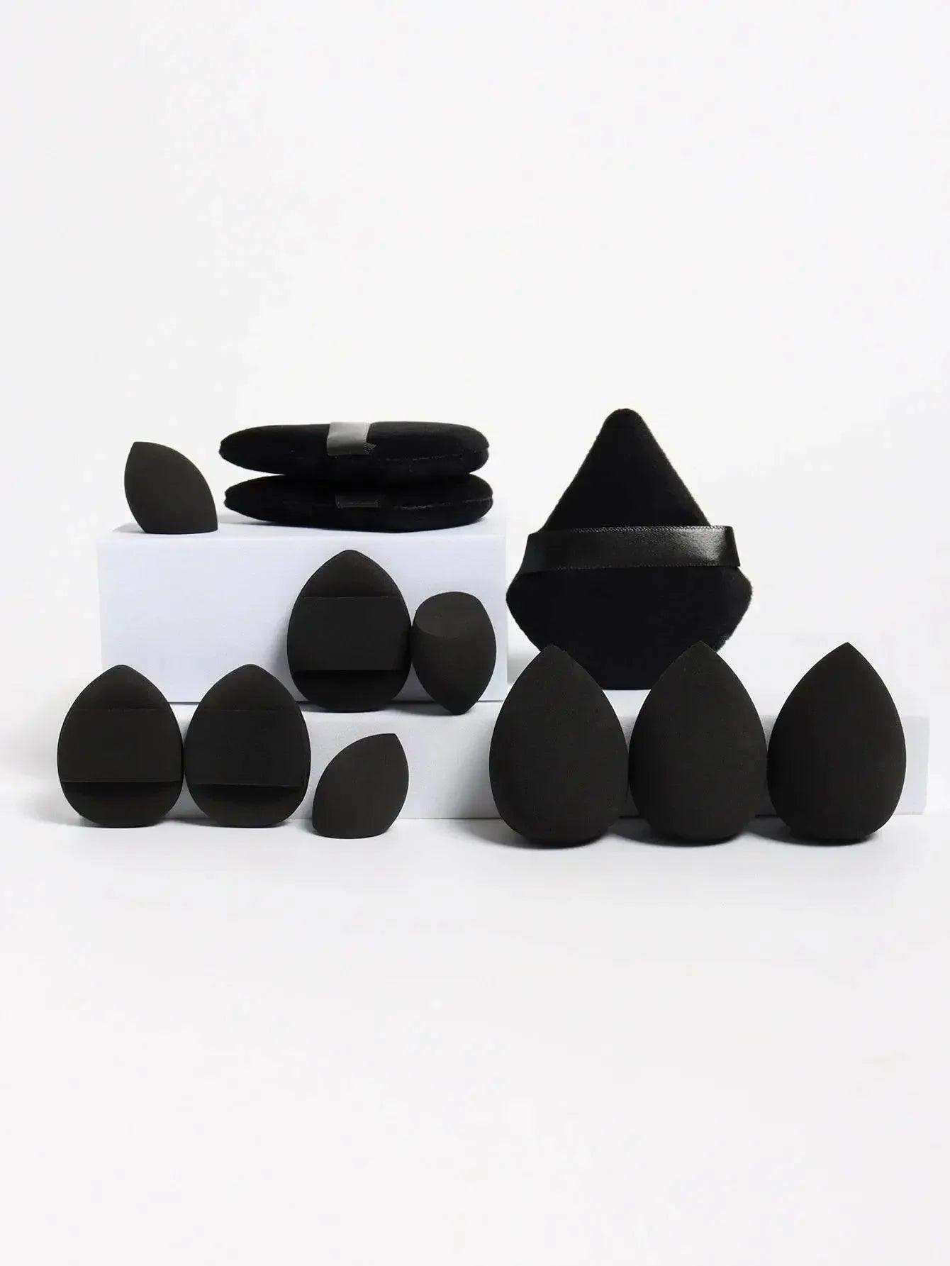 Black makeup sponges set with velvet pouches for flawless beauty application