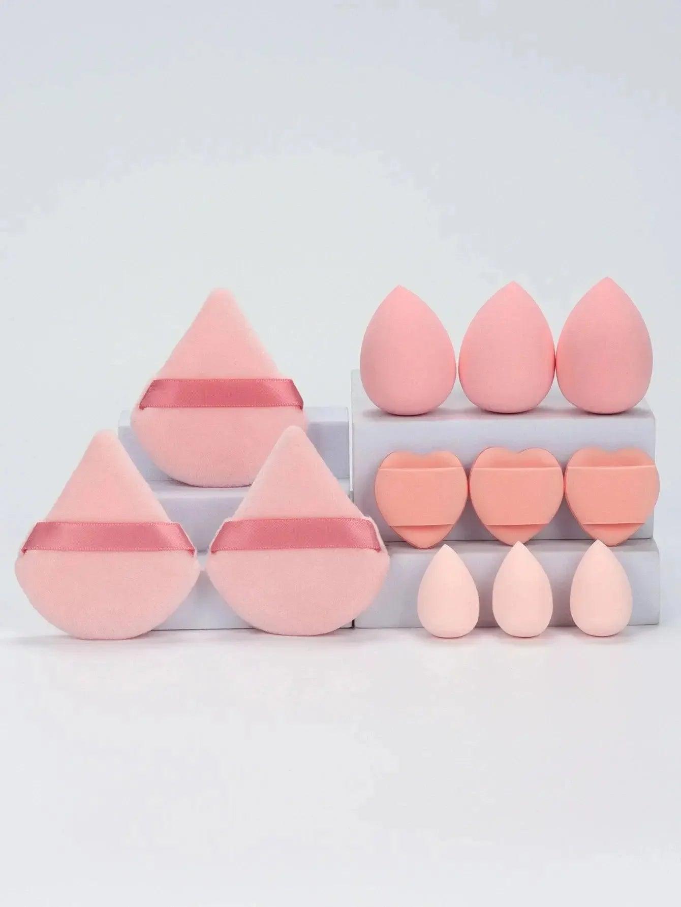 Pink makeup sponges in teardrop, heart, and round shapes for flawless beauty application