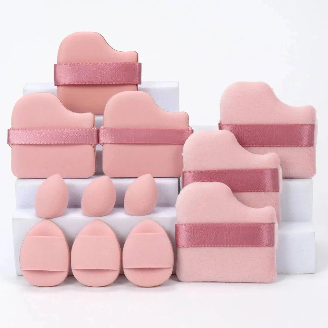Pink makeup sponges and beauty blenders with ribbon straps, ideal for flawless foundation application