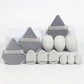 Set of gray and white makeup sponges with velvet pouches, ideal for flawless beauty application