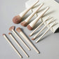 Elegant makeup brush set with cream handles and soft bristles, perfect for women's beauty routines