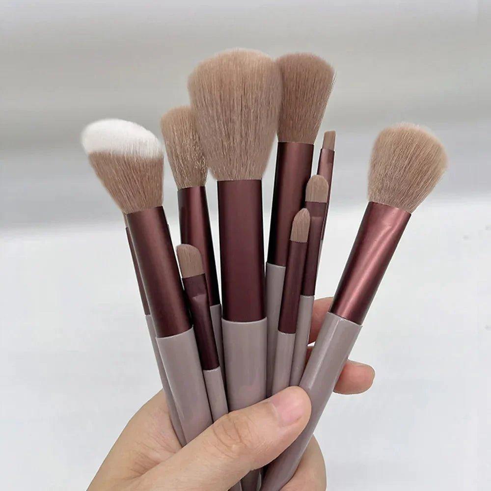 Set of soft makeup brushes with rose gold handles for face and eye application, perfect for women's beauty routines.