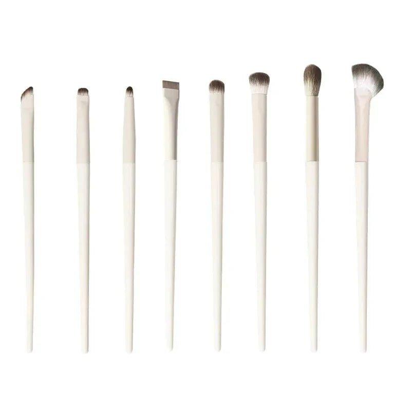 Set of 8 white makeup brushes for eyes and face, perfect for women's beauty routines