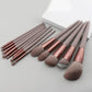 Rose gold makeup brushes set with gray handles for face and eye application