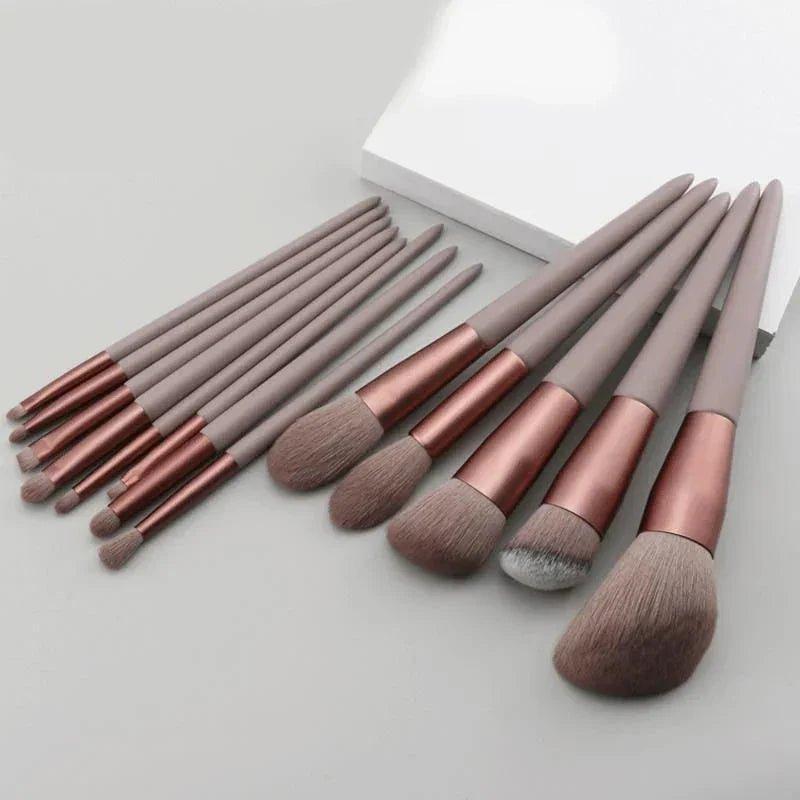 Rose gold makeup brushes set with gray handles for face and eye application