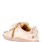 Rose gold metallic women's sneaker with perforated details and matching laces, fashion footwear