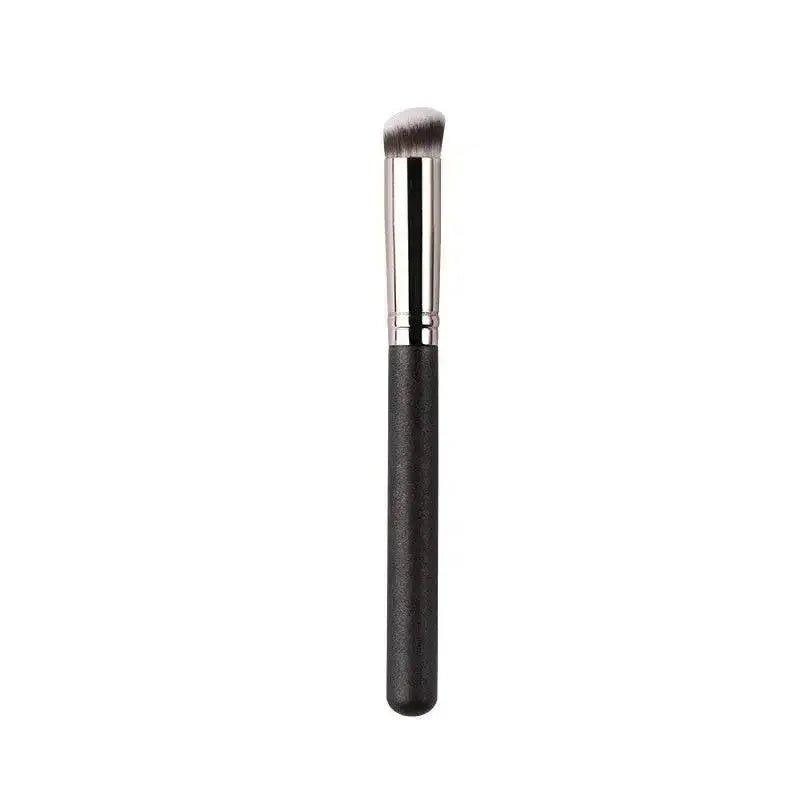 Black handle makeup brush with angled tip for precise eye shadow application