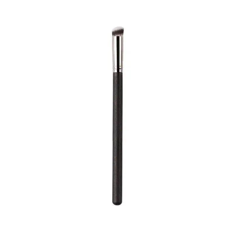 Black makeup brush with angled tip for precise eye shadow application, beauty and fashion essential