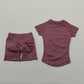 Women's mauve activewear set with high-waisted shorts and short-sleeve top, perfect for fitness and casual wear