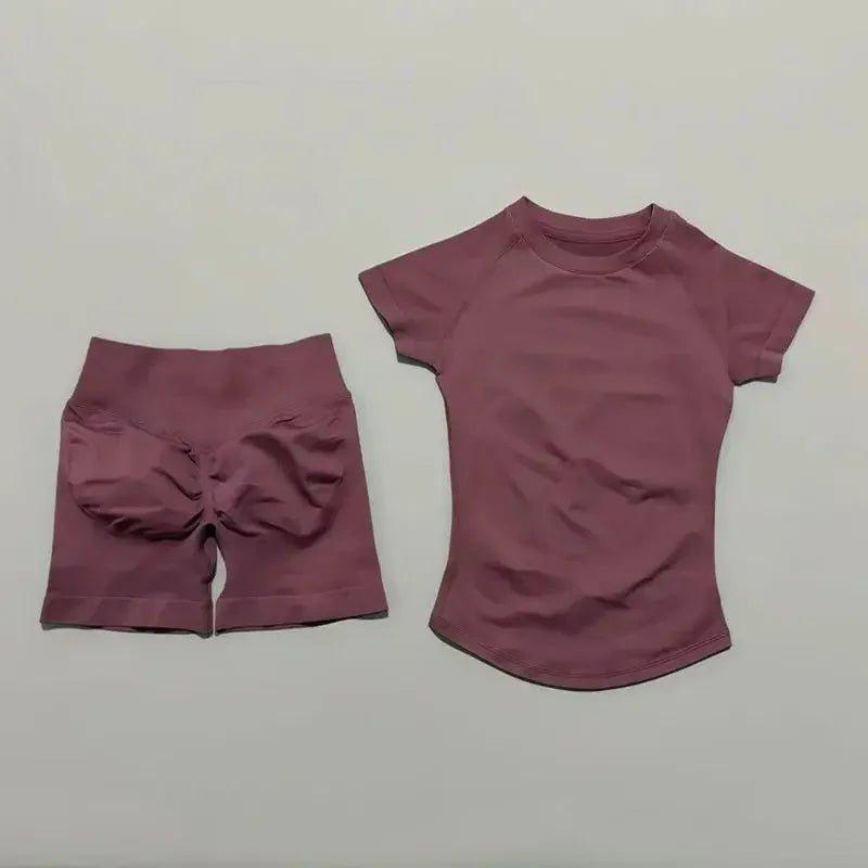 Women's mauve activewear set with high-waisted shorts and short-sleeve top, perfect for fitness and casual wear