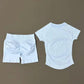 White women's workout set with ruched shorts and fitted tee, perfect for fitness fashion