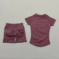 Women's mauve activewear set with short-sleeve top and high-waisted shorts, perfect for gym or yoga