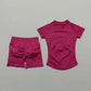 Pink women's fashion activewear set with high-waist shorts and short-sleeve top