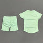 Mint green women's workout set with short sleeves and booty-enhancing shorts