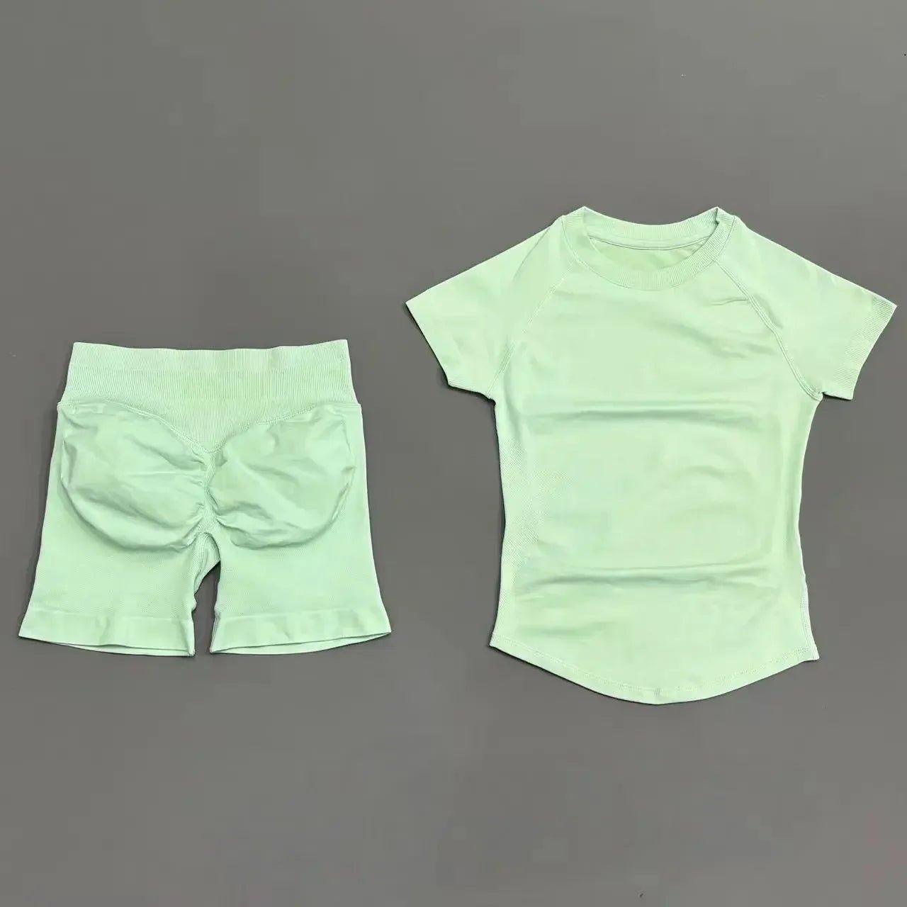 Mint green women's workout set with short sleeves and booty-enhancing shorts