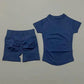 Navy blue women's activewear set with ruched shorts and short-sleeve top