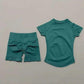 Teal women's athletic set: short sleeve top and high-waisted biker shorts for workout or casual wear