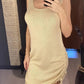 Beige knit sleeveless dress with side drawstring, perfect for women's fashion and casual style