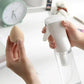 Hand holding makeup sponge and spray bottle for beauty routine