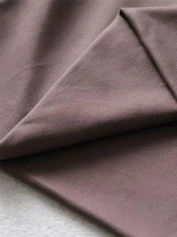 Soft mauve women's fashion fabric with smooth texture and elegant drape