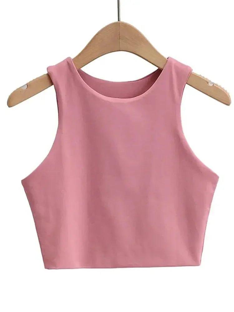 Pink sleeveless crop top for women, stylish fashion tank top on wooden hanger