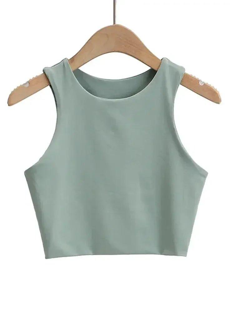 Mint green sleeveless crop top for women, stylish summer fashion on wooden hanger