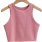 Pink sleeveless crop top for women, stylish summer fashion on wooden hanger