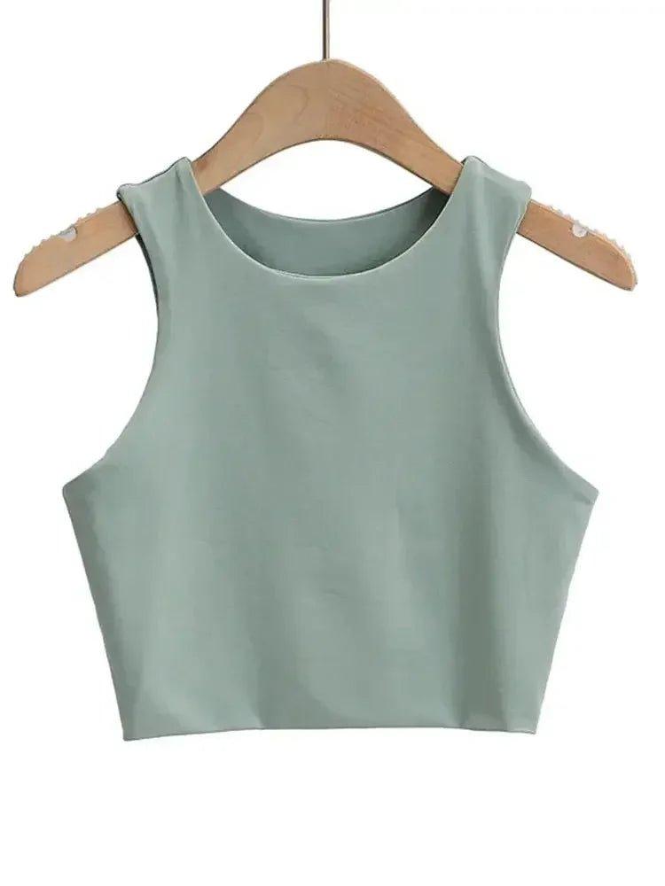 Mint green sleeveless crop top for women, stylish fashion essential on wooden hanger