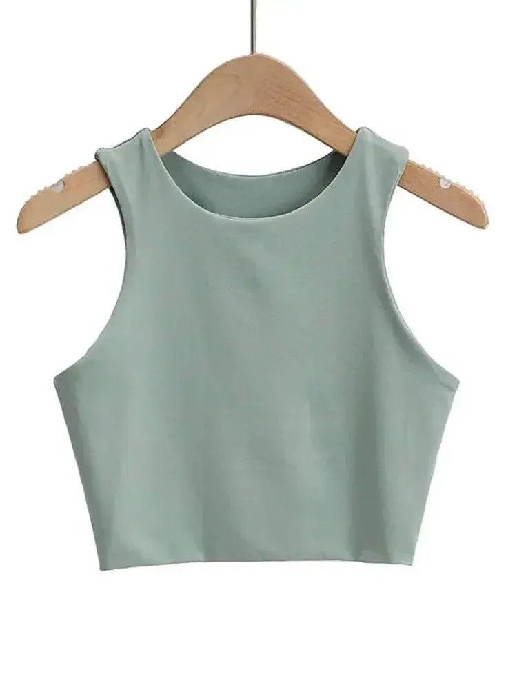Mint green sleeveless crop top for women, stylish fashion tank top on wooden hanger