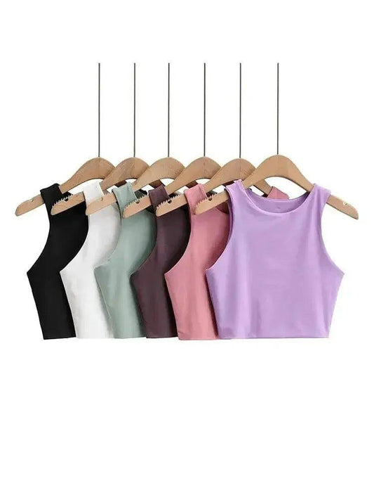 Women's sleeveless crop tops in multiple colors on wooden hangers, fashion basics